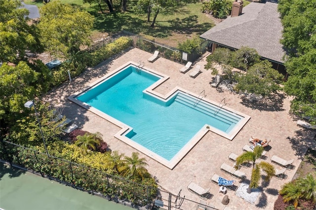 view of swimming pool with a water view