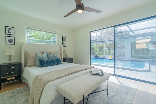 bedroom featuring ceiling fan, access to outside, and light hardwood / wood-style flooring