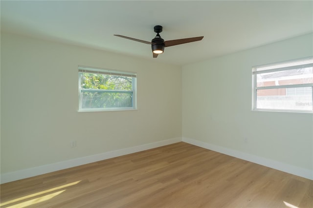 empty room featuring light hardwood / wood-style floors and ceiling fan