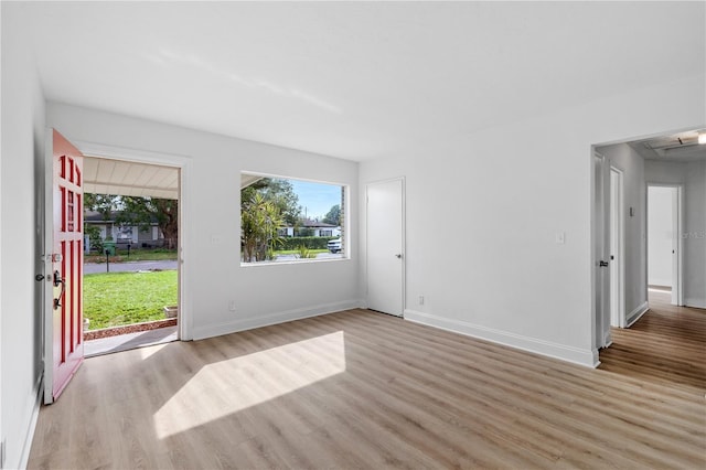 spare room featuring light wood-type flooring