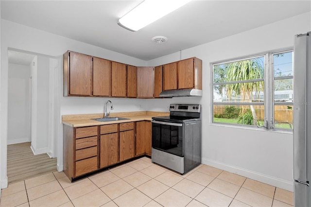 kitchen featuring light hardwood / wood-style flooring, sink, and stainless steel appliances