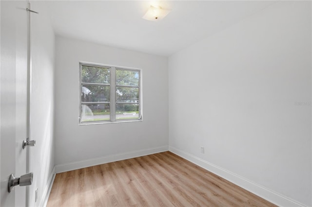 spare room with light wood-type flooring