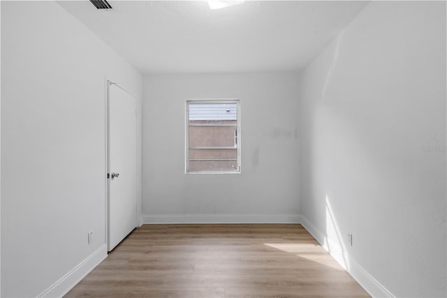 unfurnished room featuring light hardwood / wood-style floors