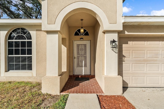 entrance to property featuring a garage