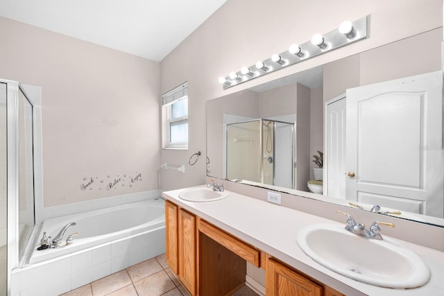 full bathroom featuring vanity, tile patterned flooring, toilet, and separate shower and tub