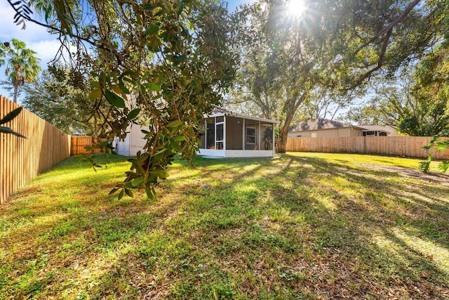 view of yard with a sunroom