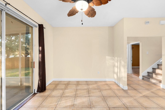 spare room featuring light tile patterned flooring and ceiling fan