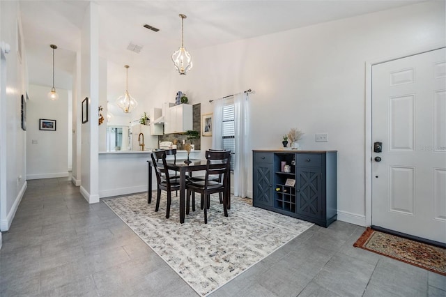 dining space featuring a notable chandelier