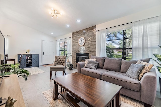 tiled living room featuring a fireplace and high vaulted ceiling