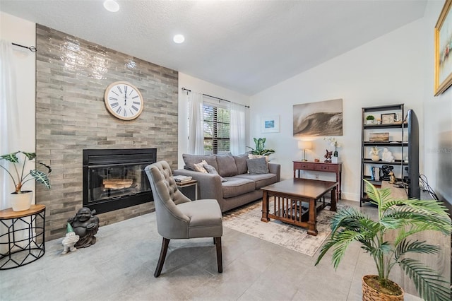 tiled living room with a textured ceiling and vaulted ceiling