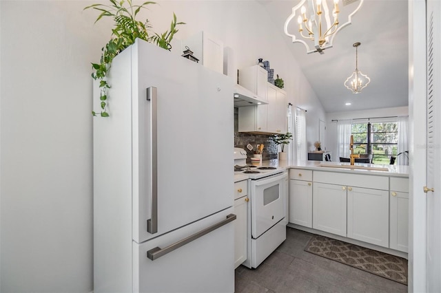 kitchen featuring white cabinetry, hanging light fixtures, white appliances, vaulted ceiling, and decorative backsplash