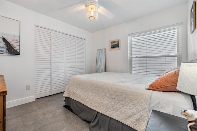 bedroom featuring ceiling fan and a closet