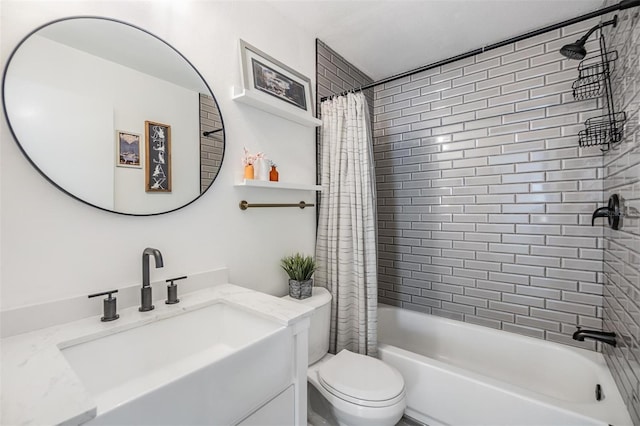 full bathroom featuring shower / bath combo, vanity, and toilet