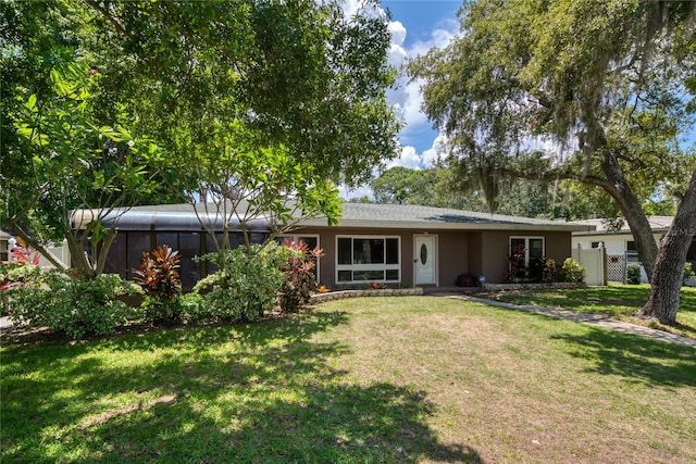 ranch-style house featuring a front lawn