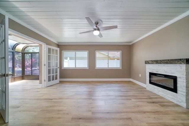 unfurnished living room with ornamental molding, a fireplace, light hardwood / wood-style floors, and wooden ceiling