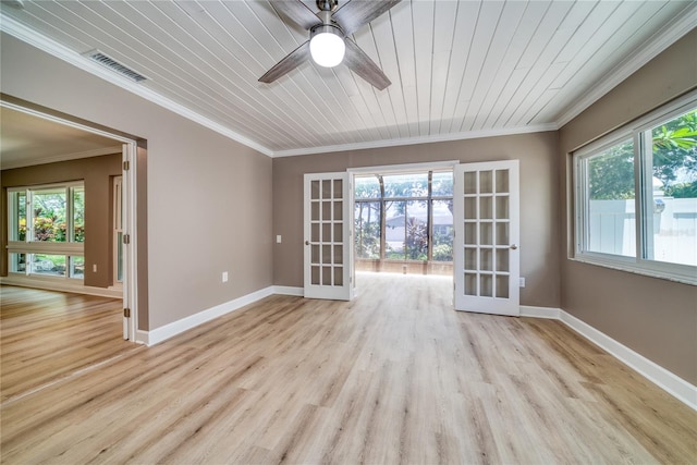 spare room featuring french doors, wood ceiling, and a wealth of natural light