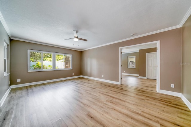 empty room with light hardwood / wood-style flooring, crown molding, and ceiling fan