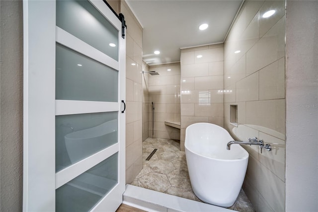 bathroom with tile walls, plus walk in shower, and tile patterned floors