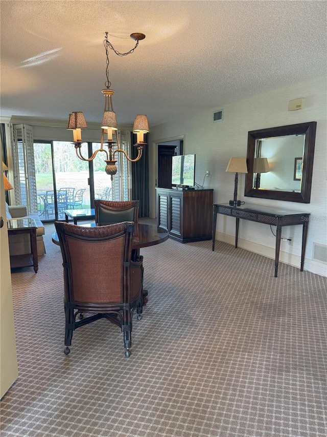 dining area featuring carpet and a textured ceiling