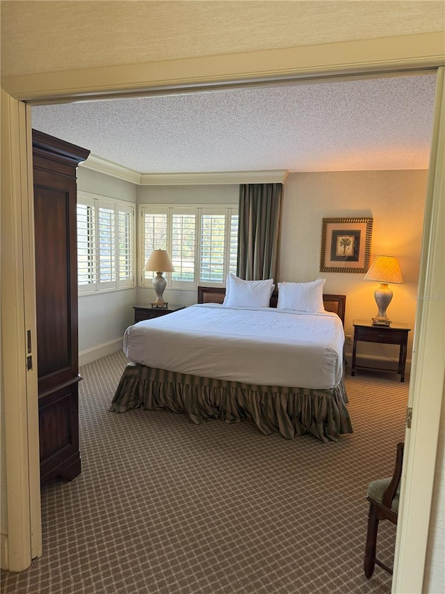 carpeted bedroom featuring a textured ceiling