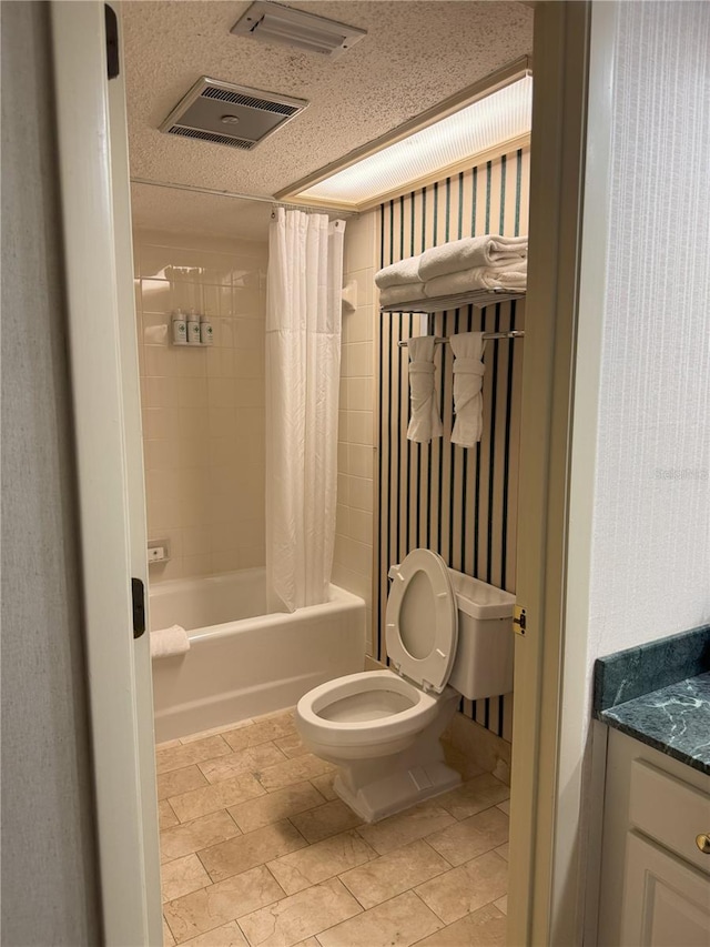 full bathroom with vanity, toilet, a textured ceiling, and shower / tub combo with curtain