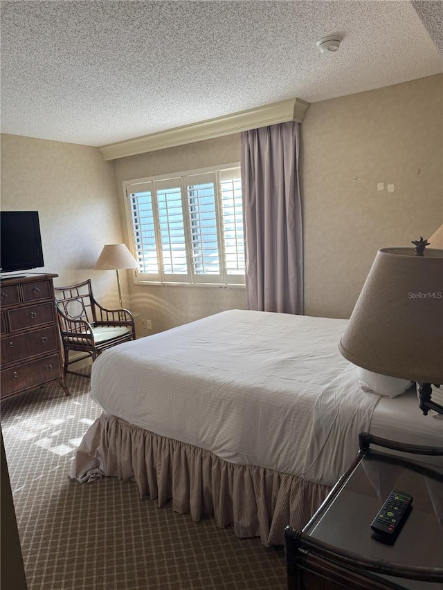 4774 Fox Hunt Drive C115 &C113, Wesley Chapel, FL 33543 - carpeted bedroom featuring a textured ceiling