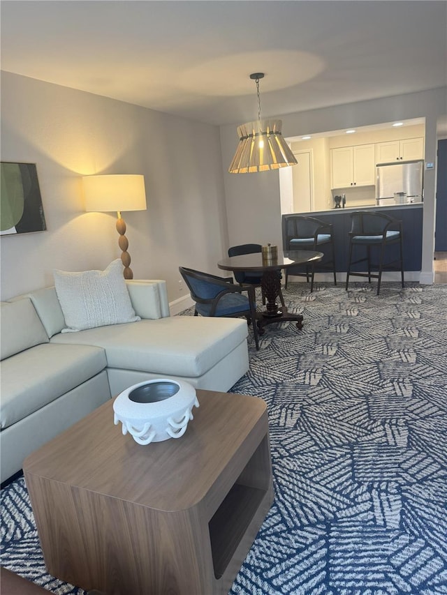 4774 Fox Hunt Drive C115 &C113, Wesley Chapel, FL 33543 - living room with baseboards and carpet flooring