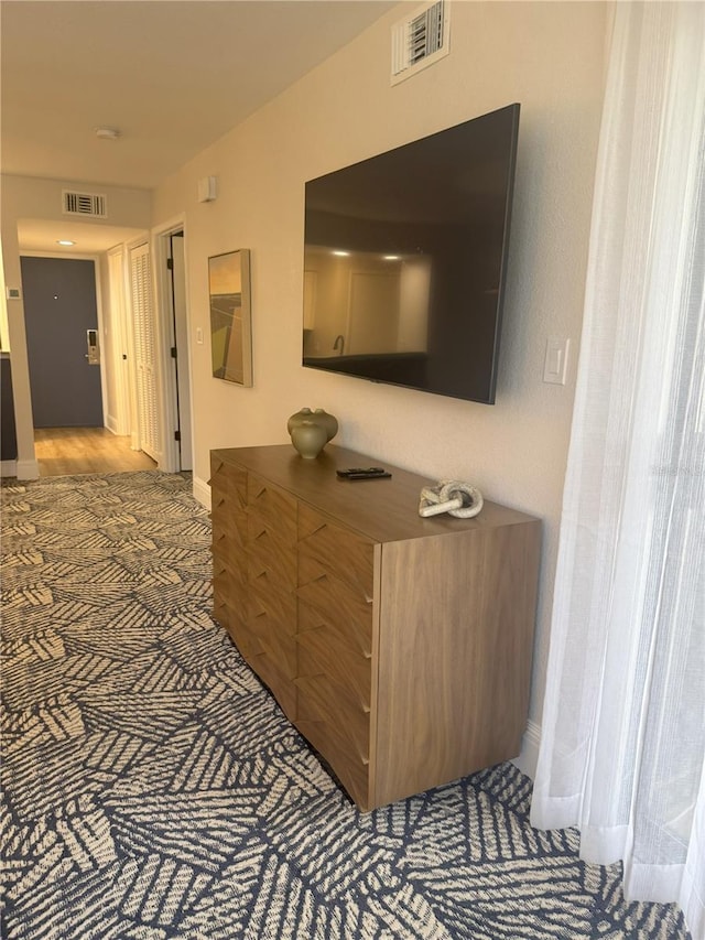 4774 Fox Hunt Drive C115 &C113, Wesley Chapel, FL 33543 - hallway with baseboards and carpet floors