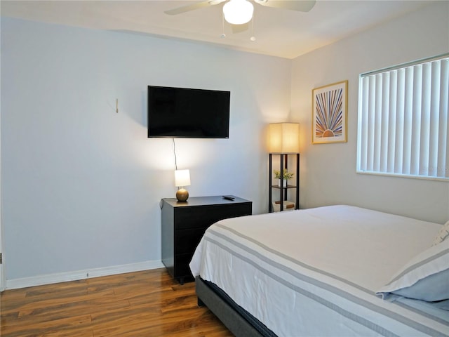 bedroom featuring dark wood-type flooring and ceiling fan