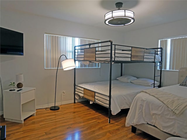 bedroom with hardwood / wood-style flooring