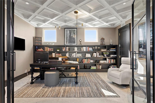 office space featuring beamed ceiling, coffered ceiling, and a healthy amount of sunlight