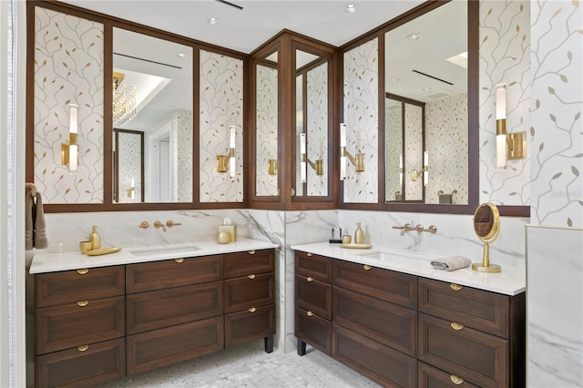 bathroom featuring vanity and backsplash