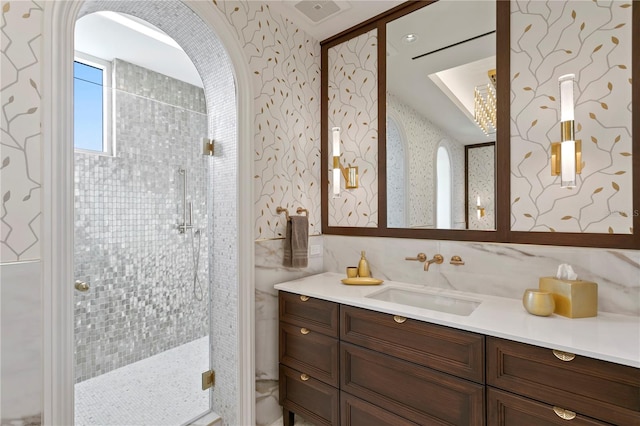 bathroom with vanity and an enclosed shower