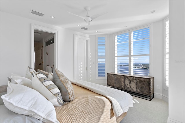 bedroom with light carpet and ceiling fan