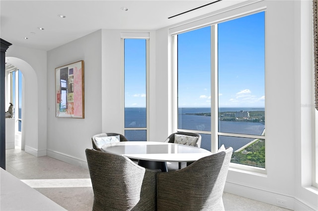 dining space with a water view