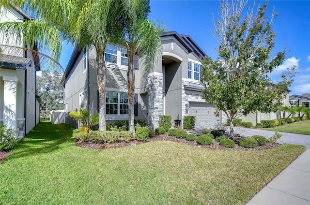 view of front of home with a front lawn and a garage