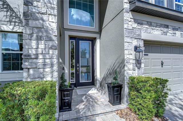 doorway to property featuring a garage