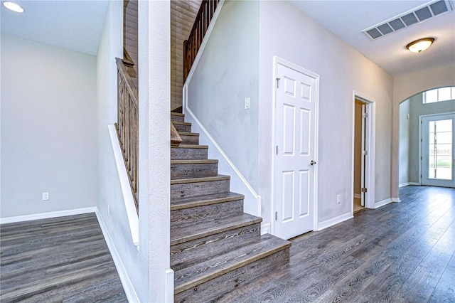 stairs featuring hardwood / wood-style flooring