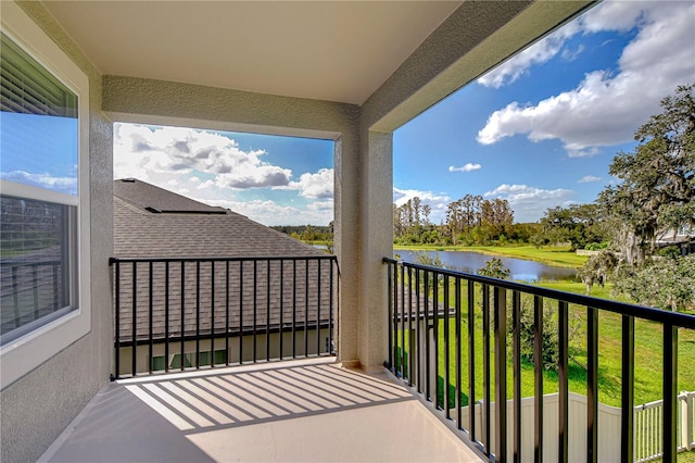 balcony featuring a water view