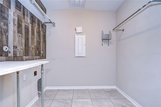 laundry area featuring light tile patterned floors