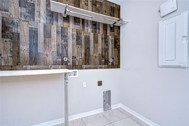 laundry room with hookup for an electric dryer, washer hookup, and light tile patterned floors