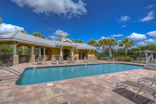 view of swimming pool featuring a patio