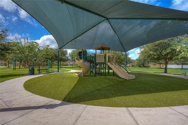 view of jungle gym featuring a lawn