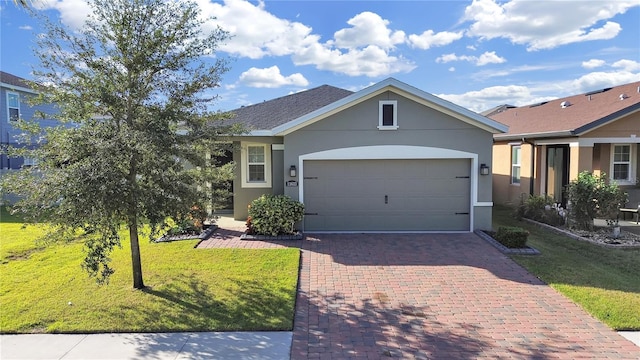 ranch-style house featuring a front yard and a garage