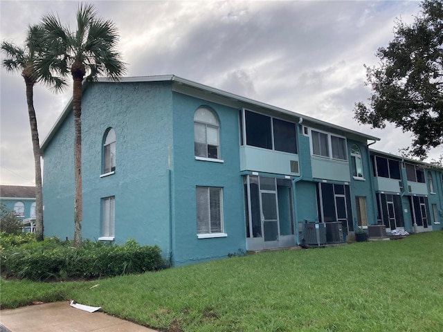 view of property featuring central AC unit