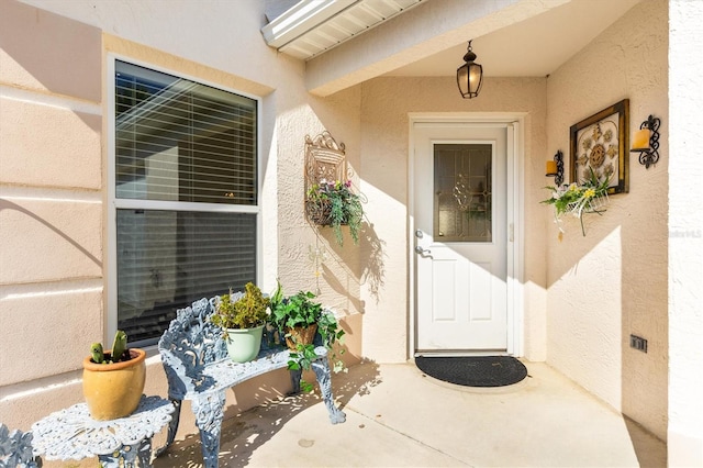 property entrance with a patio area