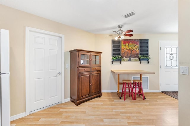 dining area featuring ceiling fan and light hardwood / wood-style flooring