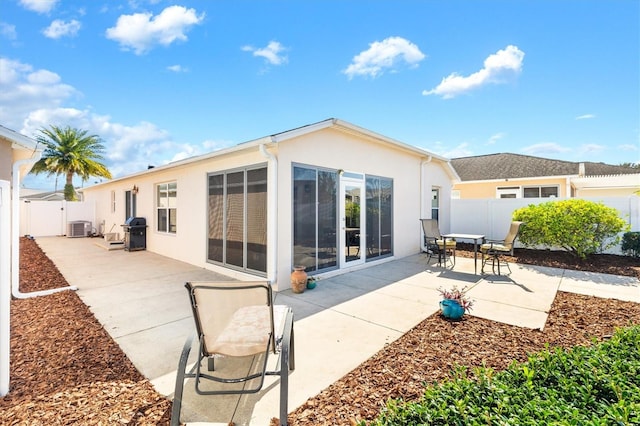 back of property featuring a patio and central AC unit