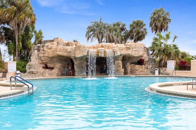 view of pool featuring pool water feature