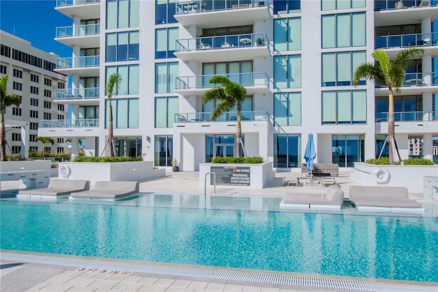 view of swimming pool featuring a patio area